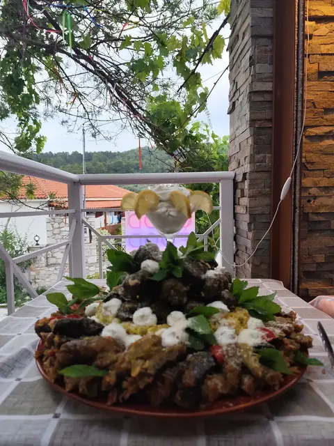 A platter of stuffed vine leaves with white cheese