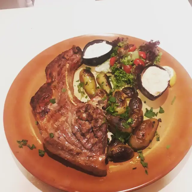 Grilled steak with vegetables and tzatziki