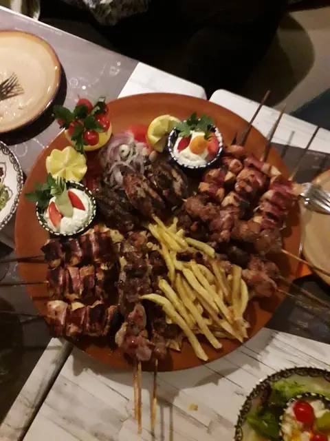 Skewers and fries on a mixed grill platter